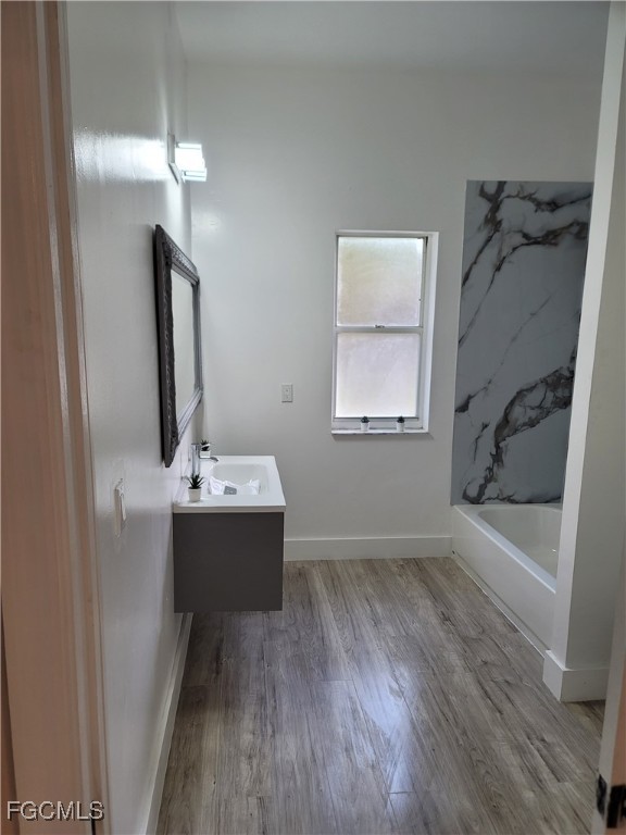 7820 Rich Road North Fort Myers, FL 33917 - Photo 26 of 26 a bathroom with a bathtub sink and mirror