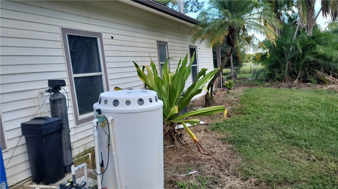 7820 Rich Road North Fort Myers, FL 33917 - Photo 5 of 26 a view of a potted plant in front of a house