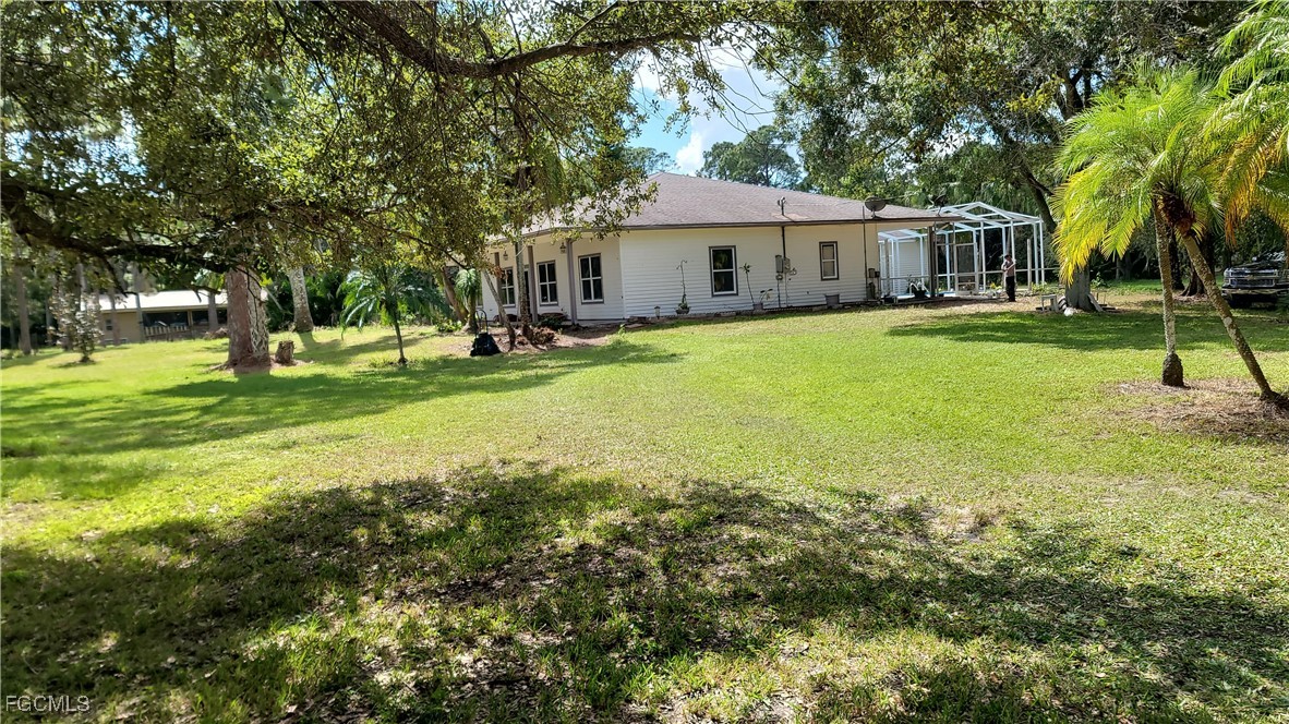 7820 Rich Road North Fort Myers, FL 33917 - Photo 8 of 26 a view of a house with a yard