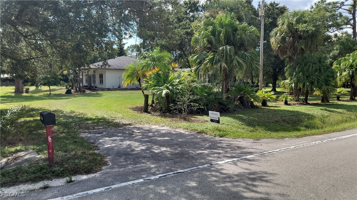 7820 Rich Road North Fort Myers, FL 33917 - Photo 9 of 26 a front view of a house with garden