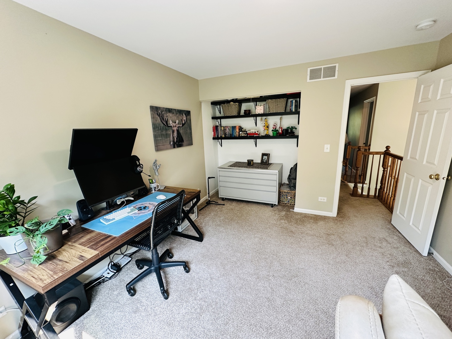 963 Oak Ridge Boulevard Elgin, IL 60120 - Photo 14 of 29 a view of a workspace with furniture and a window