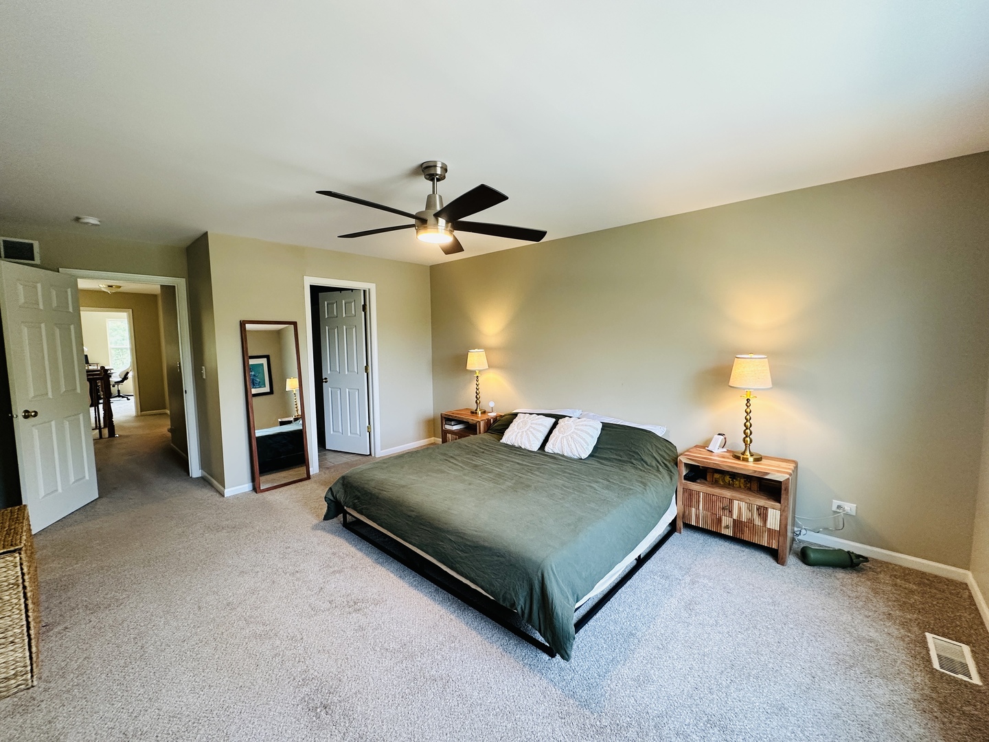 963 Oak Ridge Boulevard Elgin, IL 60120 - Photo 17 of 29 a bedroom with a bed and a chandelier