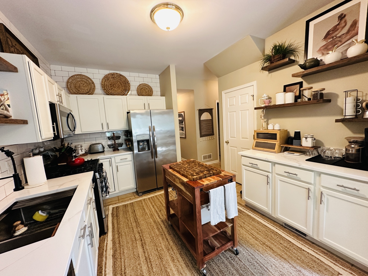 963 Oak Ridge Boulevard Elgin, IL 60120 - Photo 10 of 29 a kitchen with stainless steel appliances granite countertop a stove a sink and a refrigerator