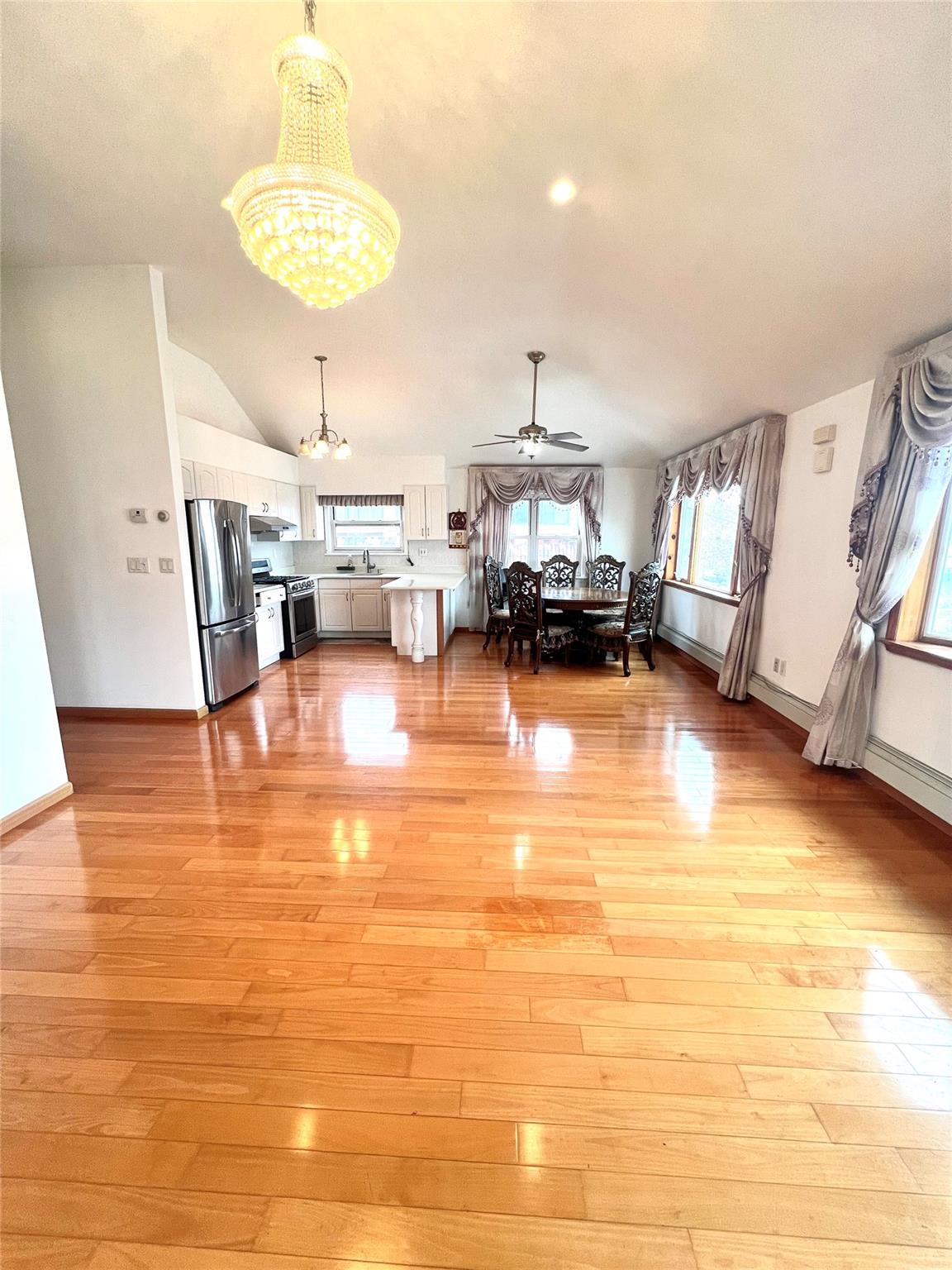 200-29 45th Road, Unit 2 Queens, NY 11361 - Photo 1 of 14 a view of kitchen and dining room with furniture