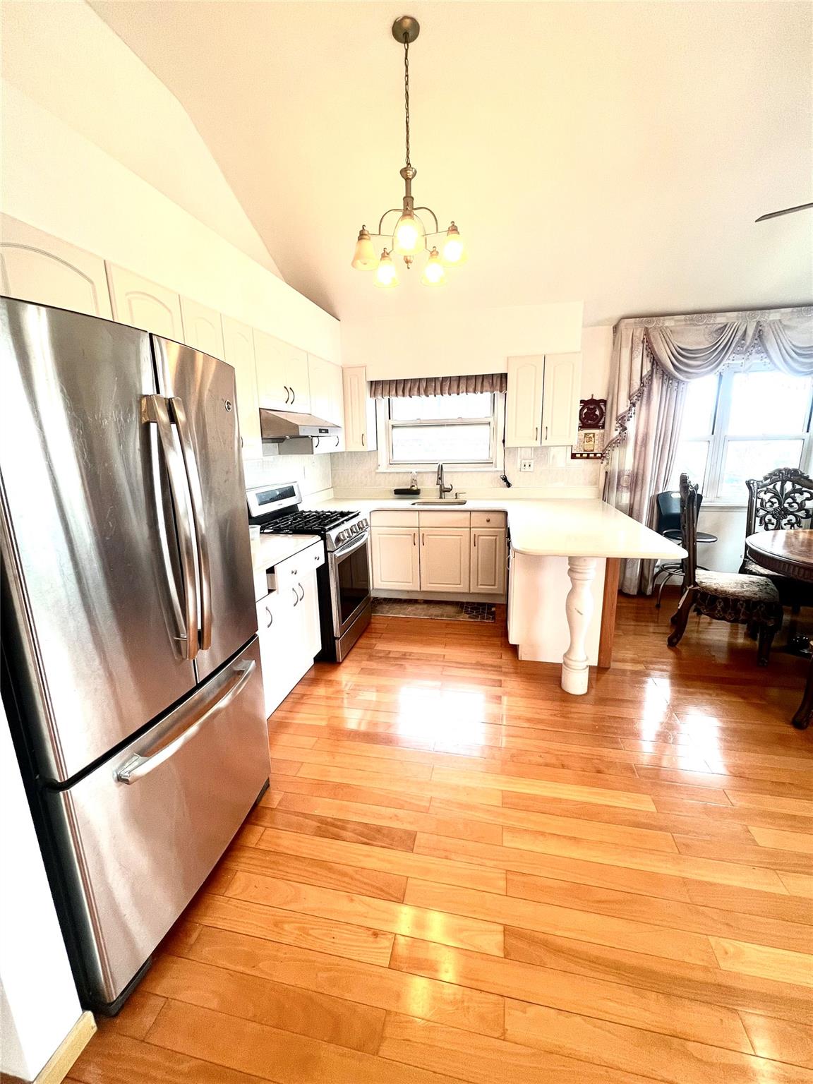200-29 45th Road, Unit 2 Queens, NY 11361 - Photo 2 of 14 a large white kitchen with a large window