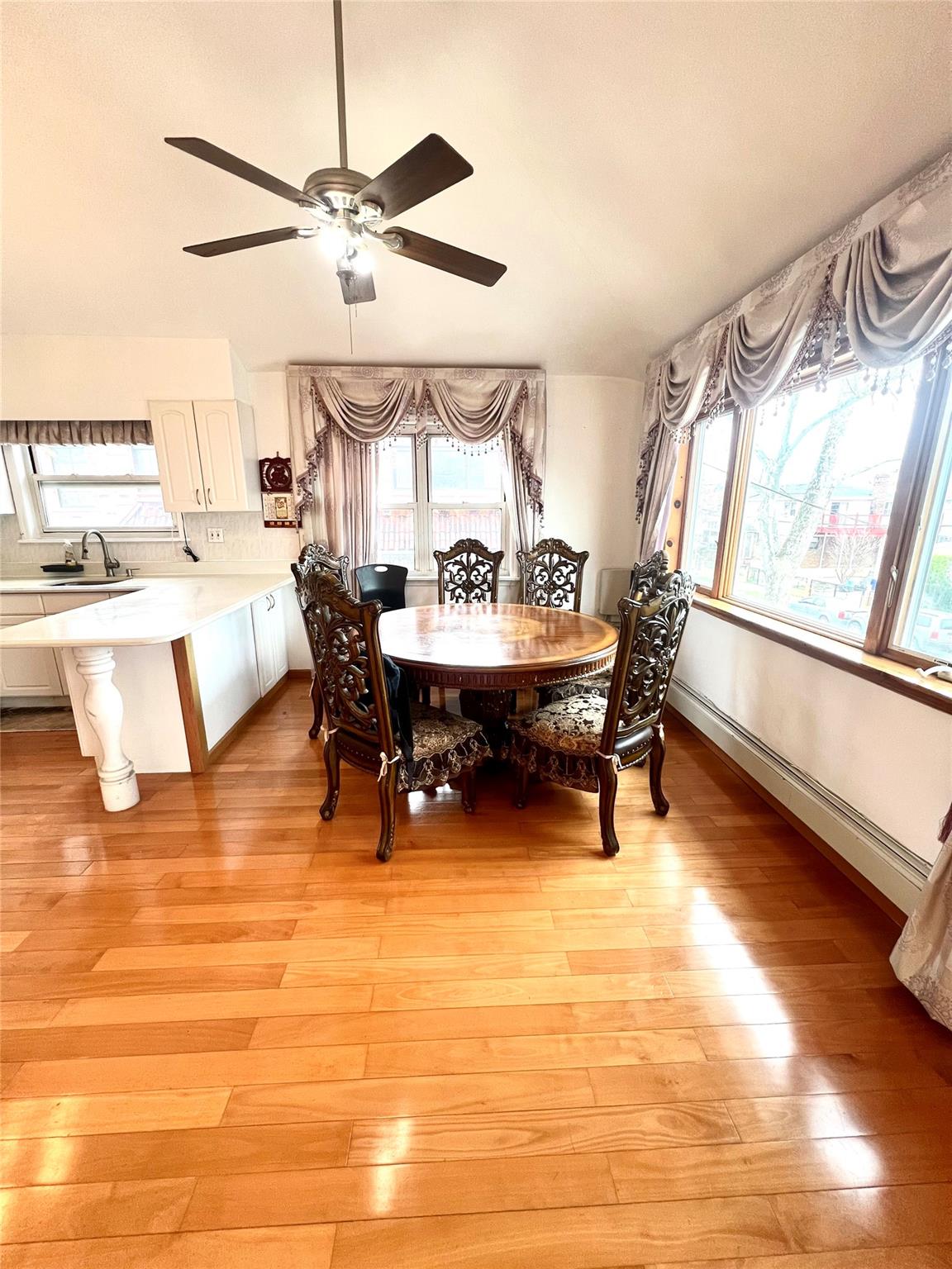 200-29 45th Road, Unit 2 Queens, NY 11361 - Photo 3 of 14 a living room with furniture and a large window