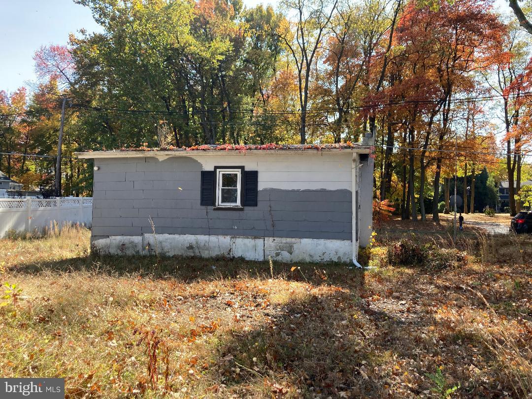 73 Mill Road Burlington, NJ 08016 - Photo 3 of 3 a view of a backyard with large trees