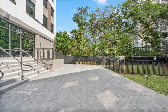 a view of a backyard with a lake view