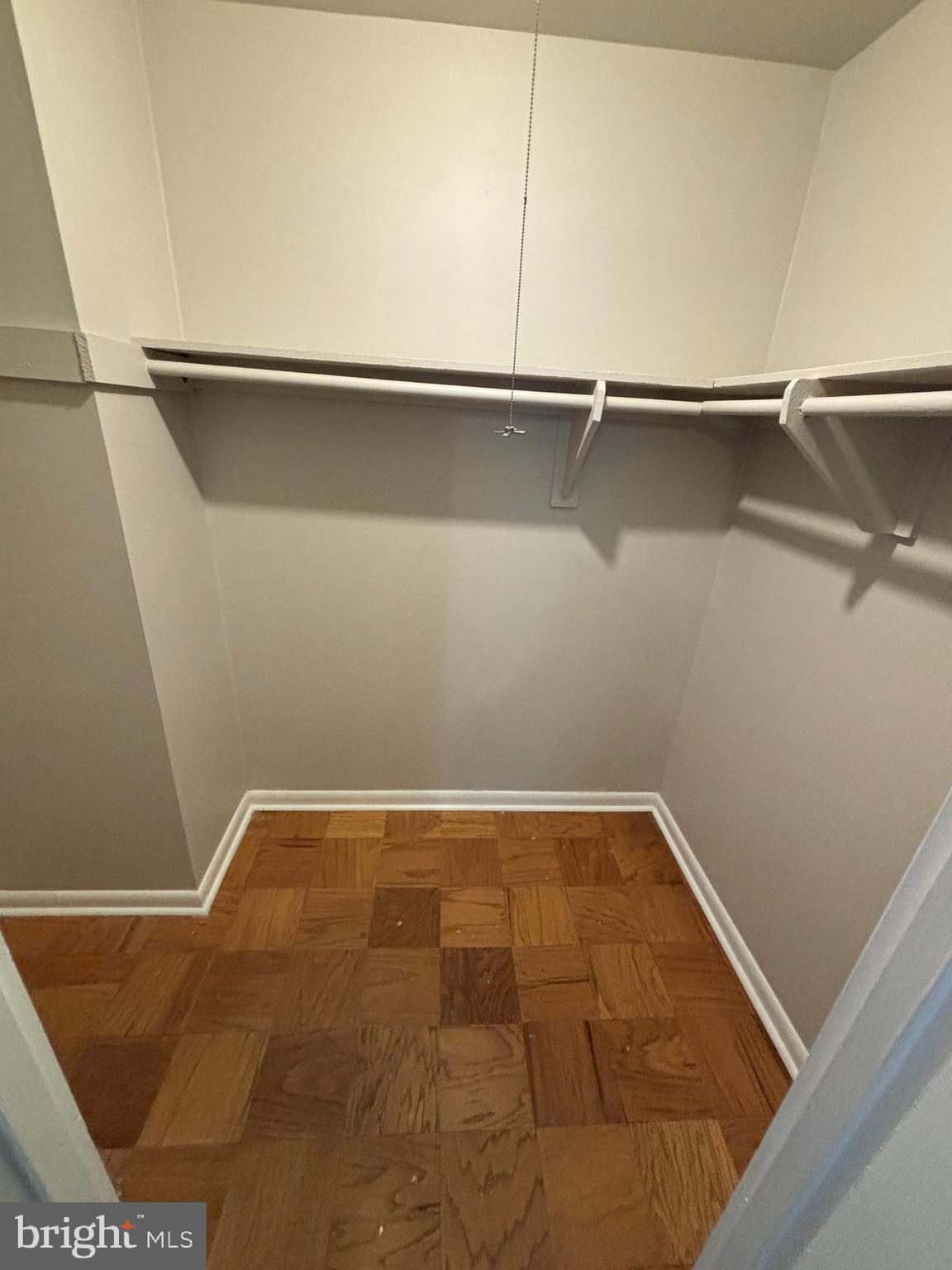 3853 St Barnabas Road, Unit 202 Suitland, MD 20746 - Photo 15 of 20 a view of a room with racks on the wall