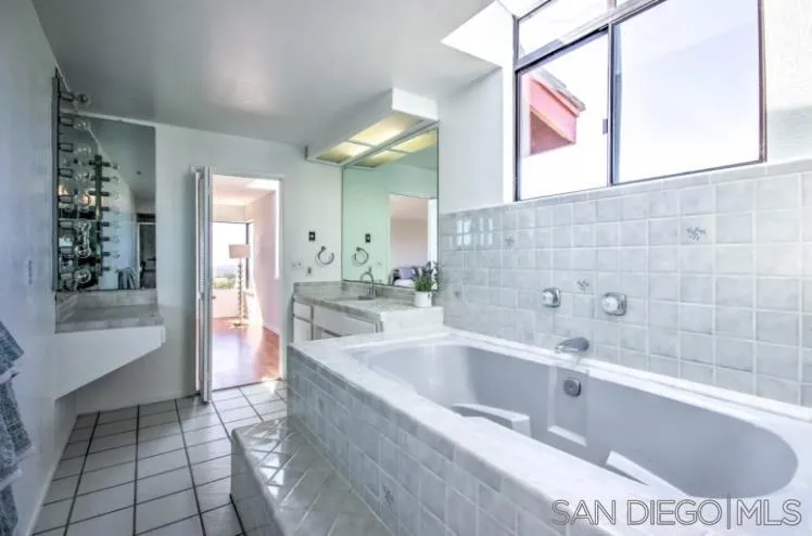404 Hidden Valley Road Watsonville, CA 95076 - Photo 12 of 69 a bathroom with a bathtub and a sink