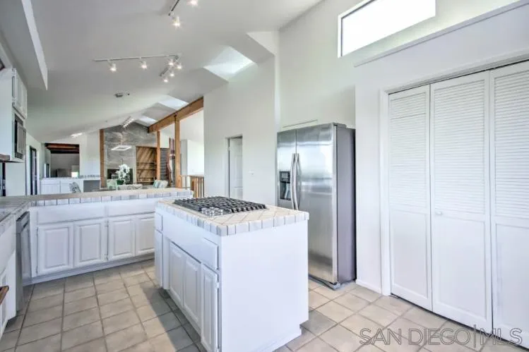 404 Hidden Valley Road Watsonville, CA 95076 - Photo 16 of 69 a kitchen with a sink stove and cabinets