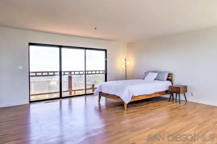 404 Hidden Valley Road Watsonville, CA 95076 - Photo 29 of 69 a spacious bedroom with a bed and a large window