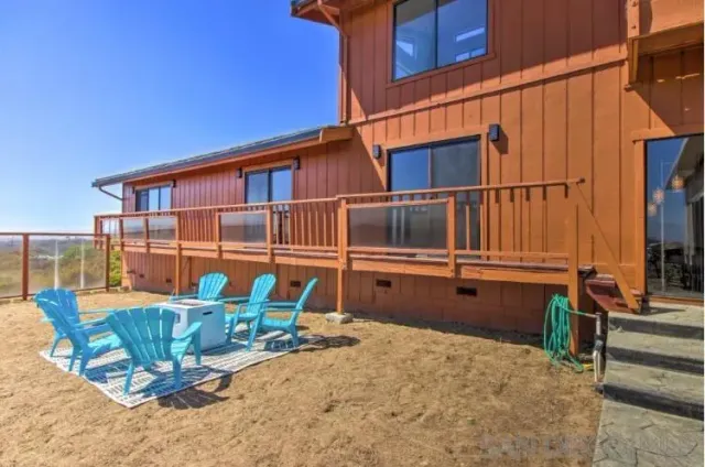 a bedroom with a bed and a mirror