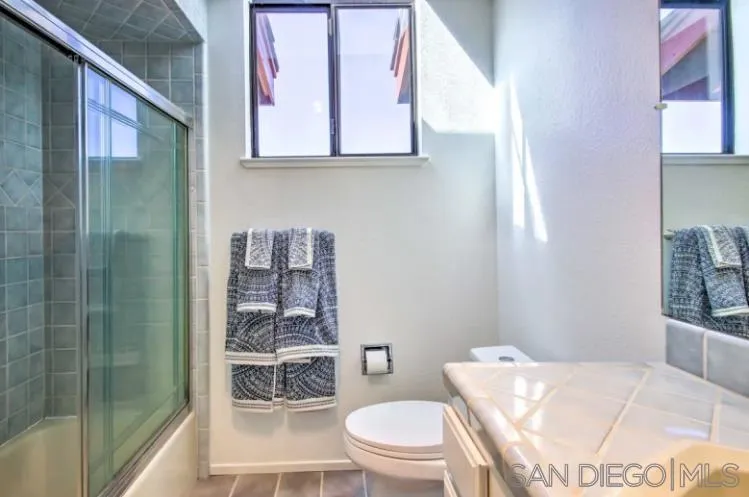 404 Hidden Valley Road Watsonville, CA 95076 - Photo 36 of 69 a bathroom with a toilet a sink and shower