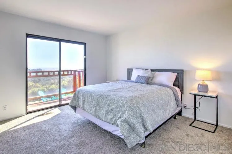 404 Hidden Valley Road Watsonville, CA 95076 - Photo 38 of 69 a bedroom with a bed and a night stand