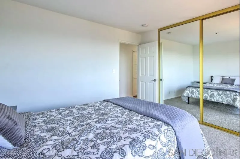 404 Hidden Valley Road Watsonville, CA 95076 - Photo 48 of 69 a bedroom with a bed and a mirror