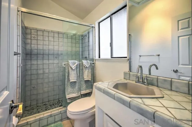 404 Hidden Valley Road Watsonville, CA 95076 - Photo 52 of 69 a bathroom with a sink a toilet and shower