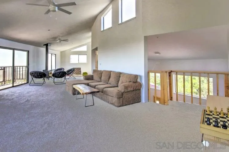 404 Hidden Valley Road Watsonville, CA 95076 - Photo 9 of 69 a living room with furniture and a large window