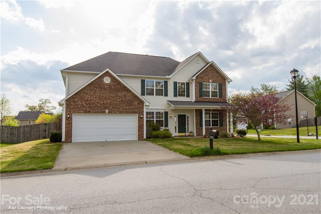 238 Wildbriar Road Fletcher, NC 28732 - Photo 3 of 27 a front view of a house with a yard and garage