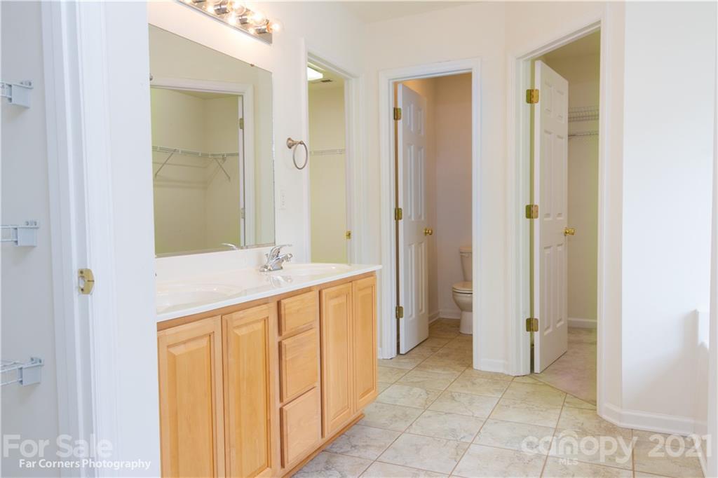 238 Wildbriar Road Fletcher, NC 28732 - Photo 22 of 27 a bathroom with a sink and a mirror