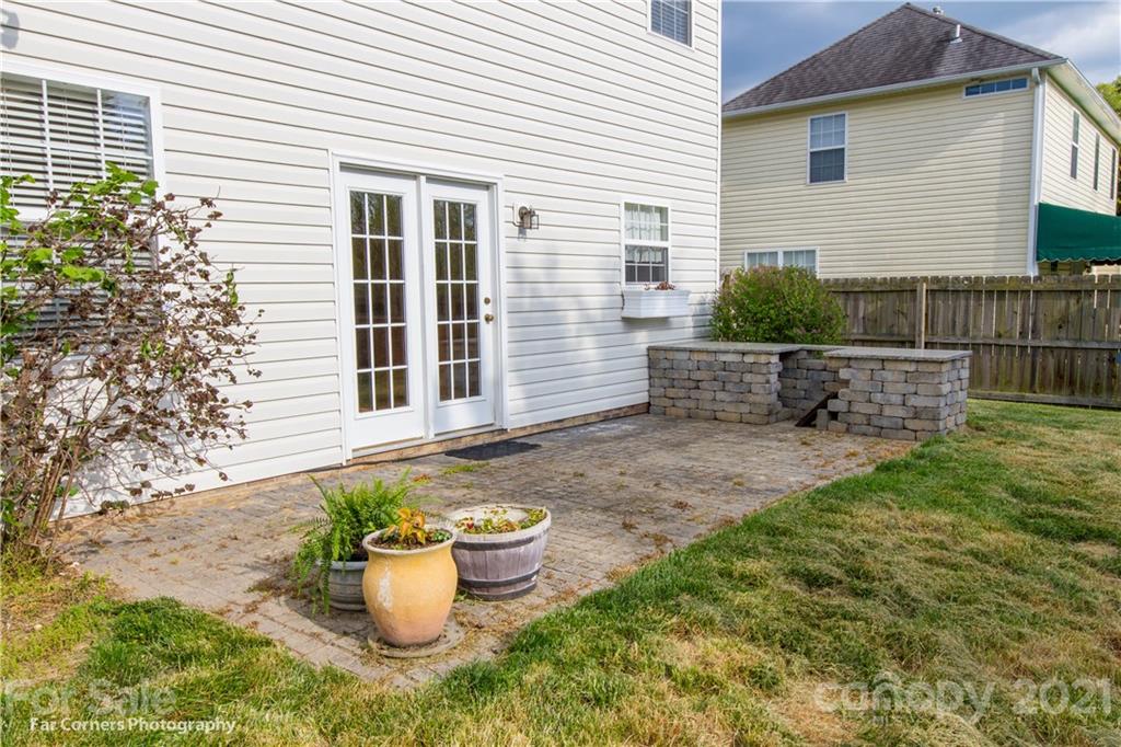 238 Wildbriar Road Fletcher, NC 28732 - Photo 5 of 27 a view of a backyard with sitting area