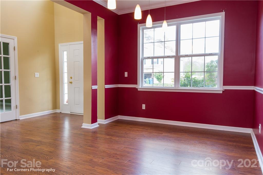 238 Wildbriar Road Fletcher, NC 28732 - Photo 8 of 27 an empty room with wooden floor and windows