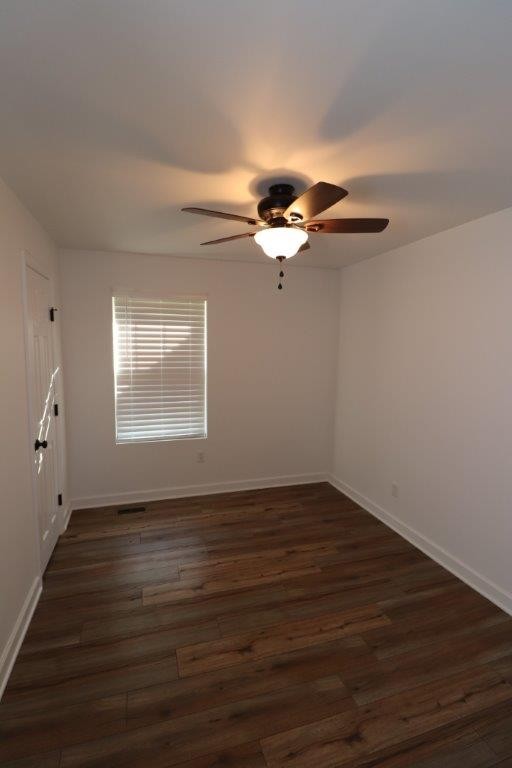 6431 Old Bottom Road Pleasant Shade, TN 37145 - Photo 16 of 38 a view of an empty room with wooden floor and a window