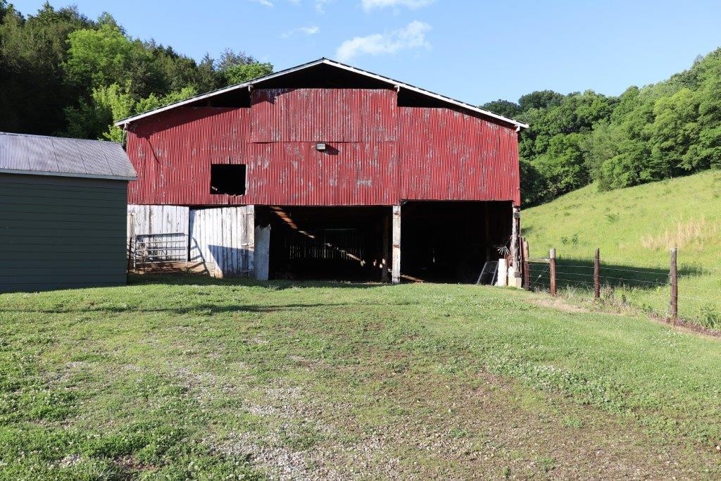 6431 Old Bottom Road Pleasant Shade, TN 37145 - Photo 17 of 38 a front view of a house with a yard