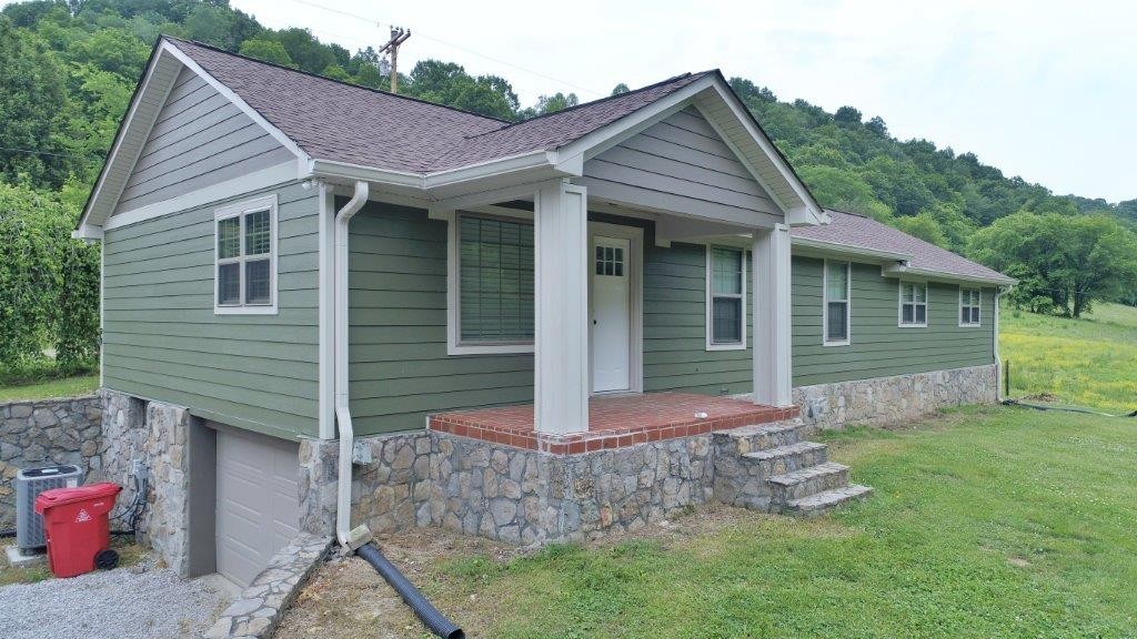 6431 Old Bottom Road Pleasant Shade, TN 37145 - Photo 3 of 38 a front view of a house with garden