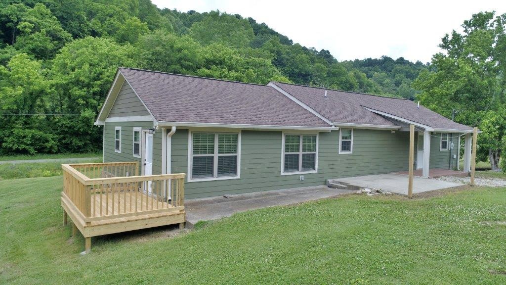 6431 Old Bottom Road Pleasant Shade, TN 37145 - Photo 4 of 38 a view of a house with a backyard and a garden