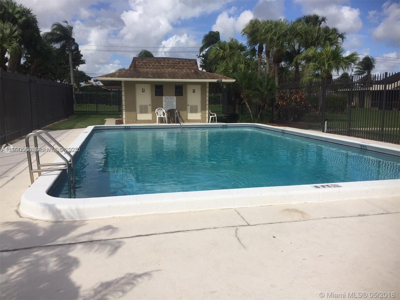 10295 Boca Bend West, Unit L3 Boca Raton, FL 33428 - Photo 3 of 3 a view of swimming pool with a yard