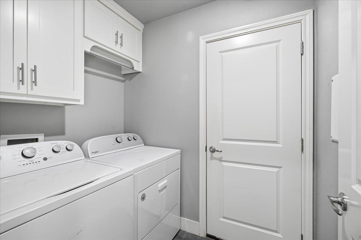 7502 89th Street Lubbock, TX 79424 - Photo 22 of 26 a utility room with dryer and washer
