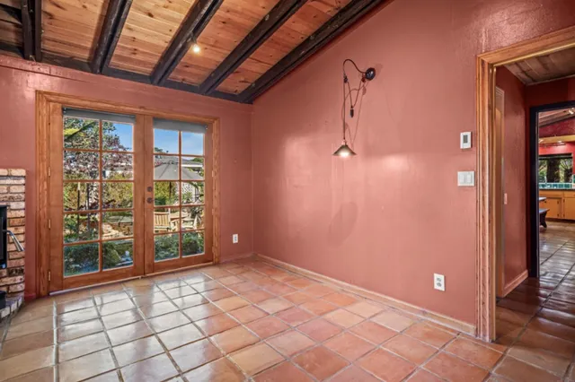 a view of an empty room with windows