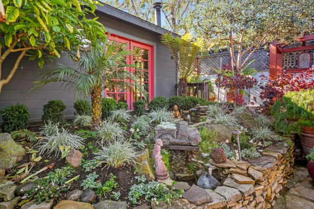 a view of a chairs and table under an umbrella
