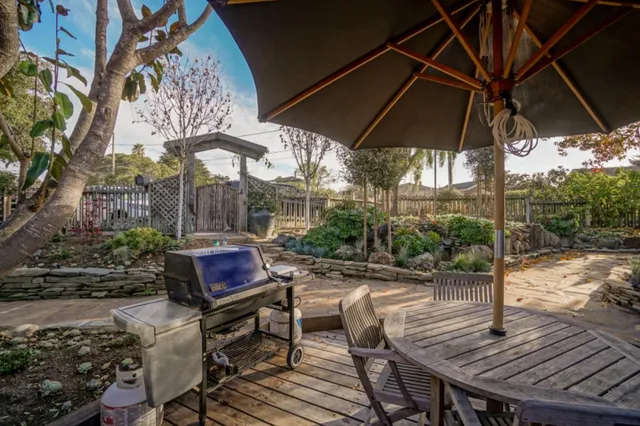 a room with granite countertop lots of wooden furniture