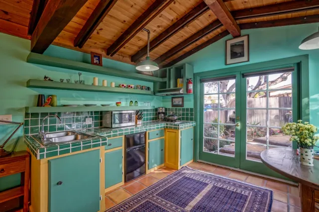 a bathroom with a shower and a sink