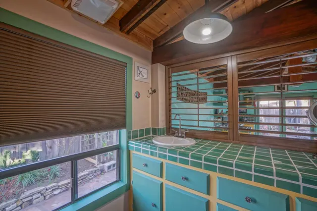a view of a patio with couches table and chairs and potted plants