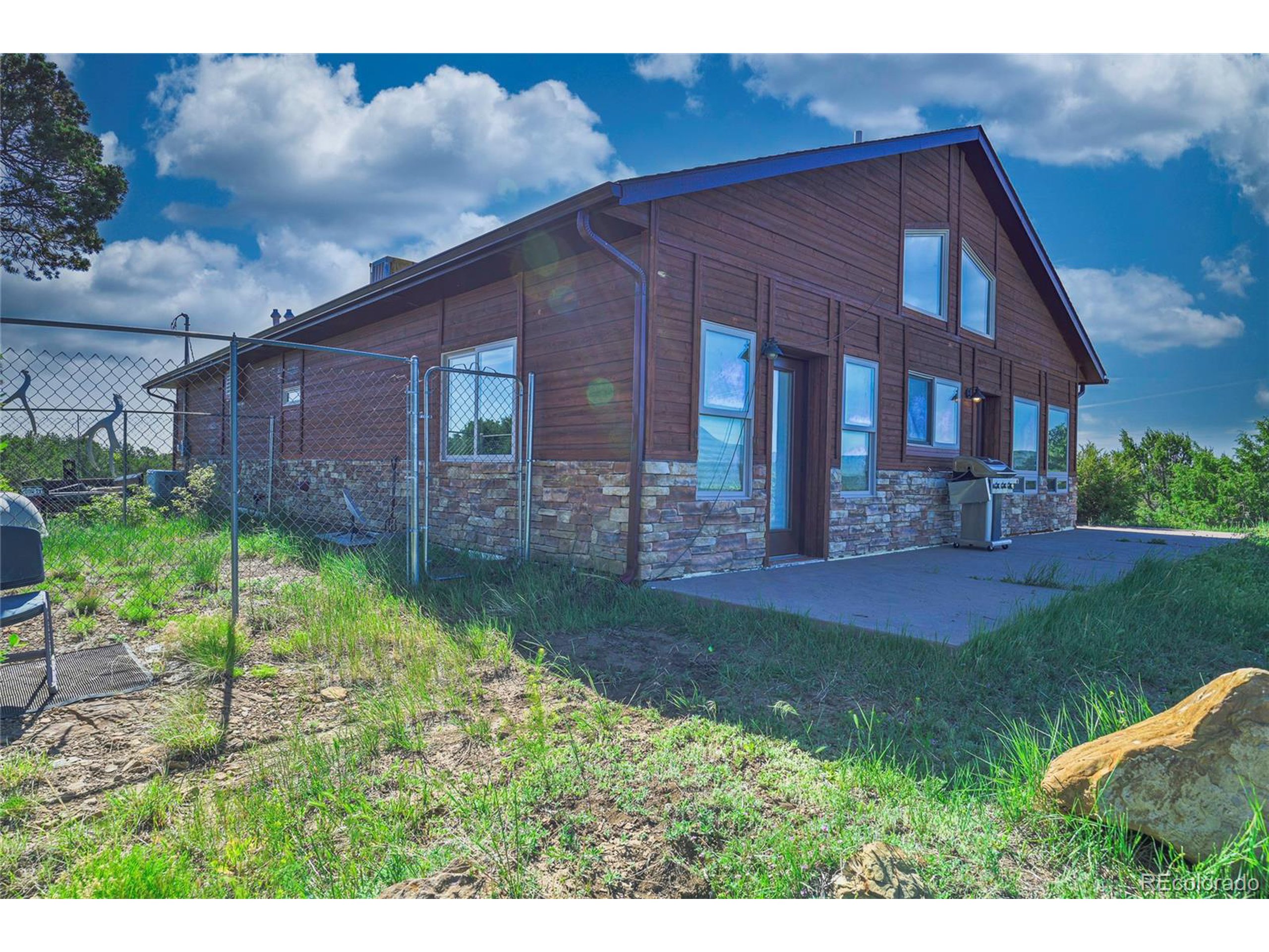a backyard of a house with lots of green space
