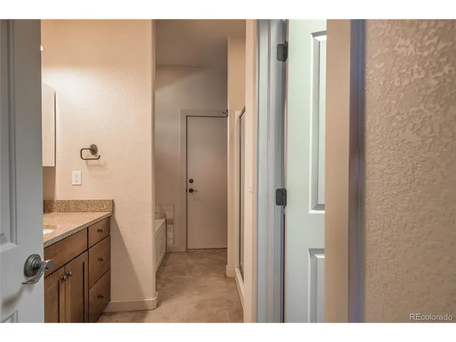 a view of a bathroom with a sink and mirror