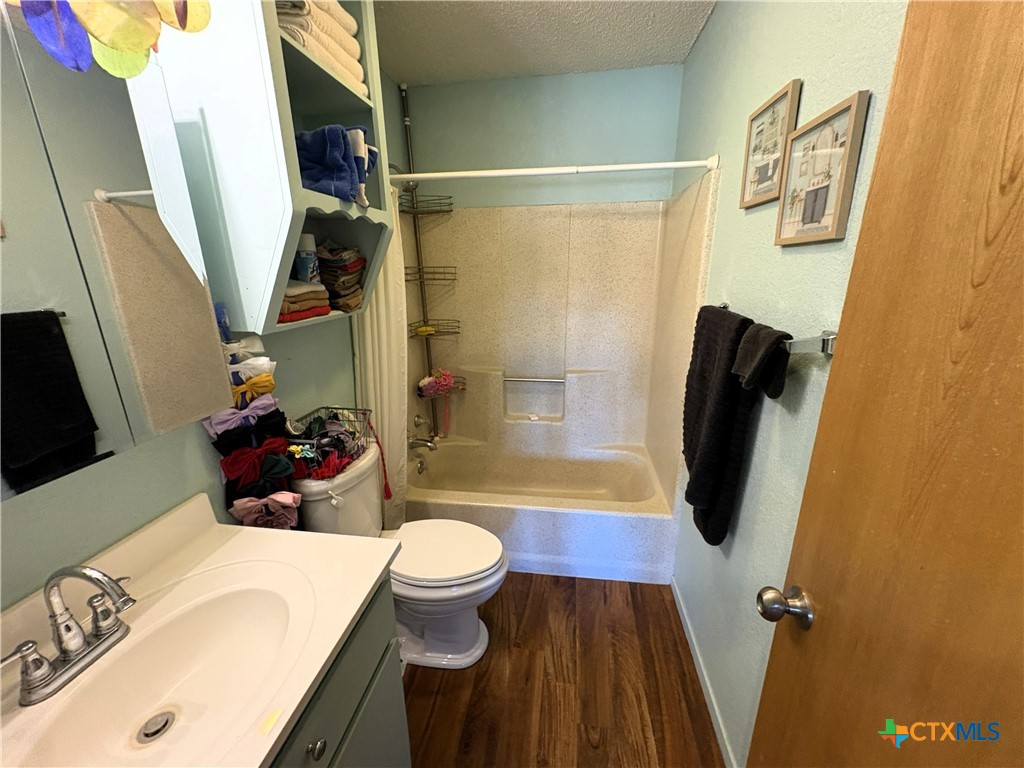 936 County Road 109 Riesel, TX 76682 - Photo 12 of 22 a bathroom with a sink toilet and shower