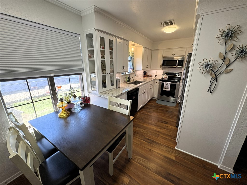 936 County Road 109 Riesel, TX 76682 - Photo 5 of 22 a view of a dining room with furniture and a potted plant