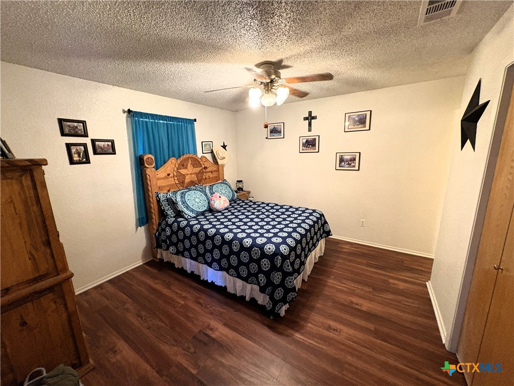 936 County Road 109 Riesel, TX 76682 - Photo 7 of 22 a bedroom with a bed window and a table