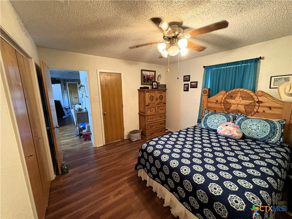 936 County Road 109 Riesel, TX 76682 - Photo 8 of 22 a bedroom with a bed and wooden floor