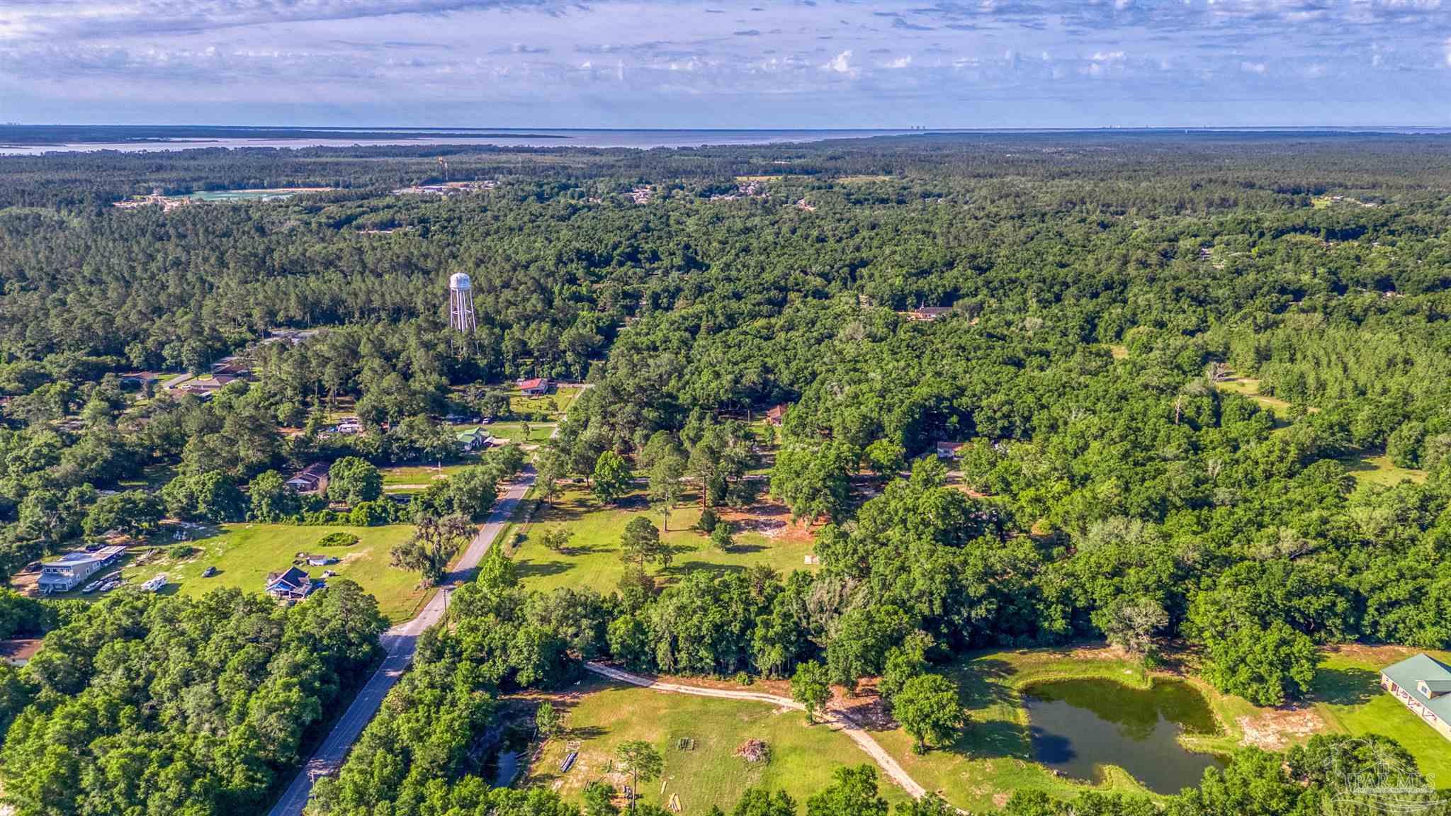 0 Morrison Road Milton, FL 32583 - Photo 12 of 21 a view of a lake with a city
