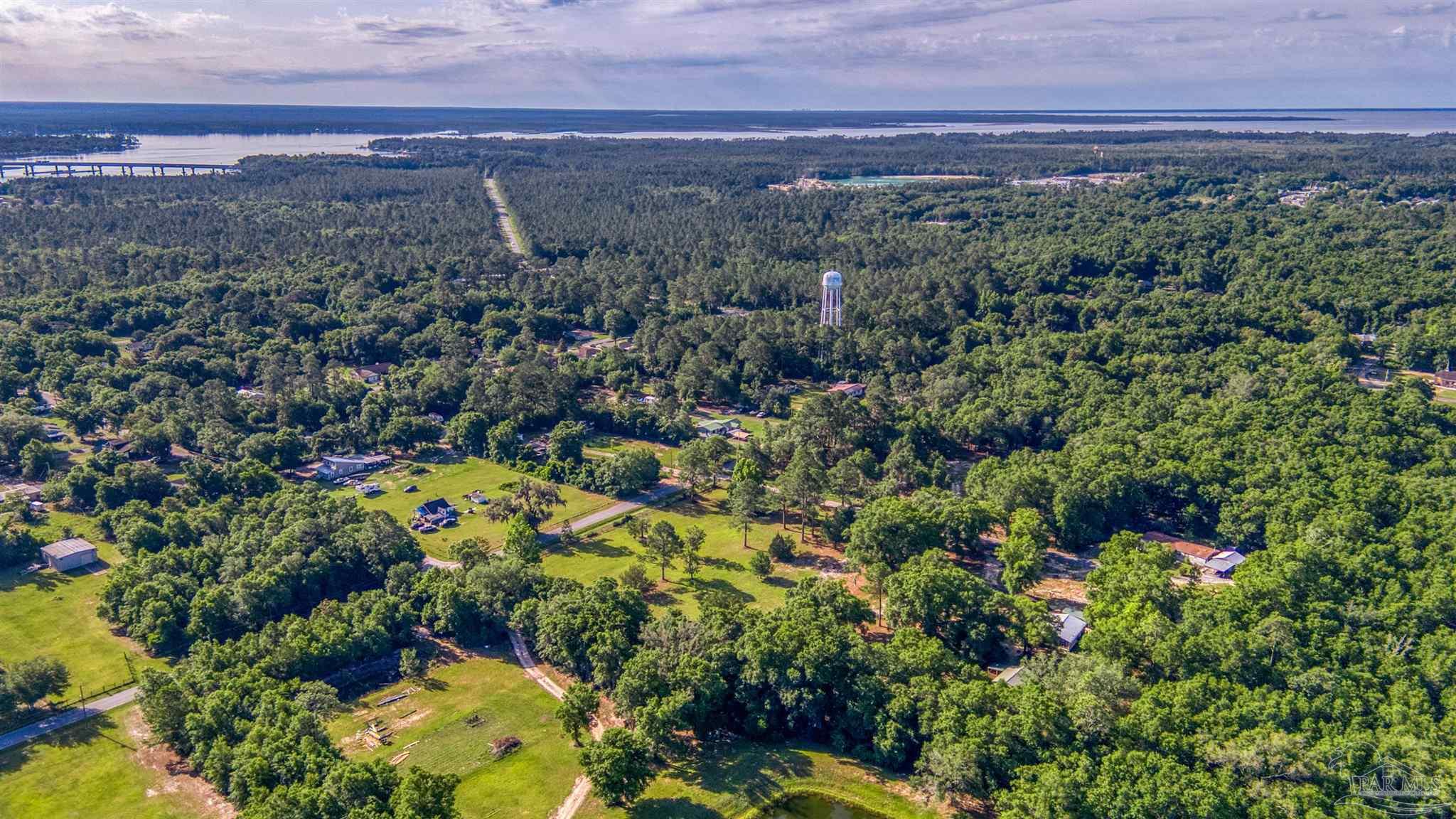 0 Morrison Road Milton, FL 32583 - Photo 13 of 21 a view of a city with lush green forest