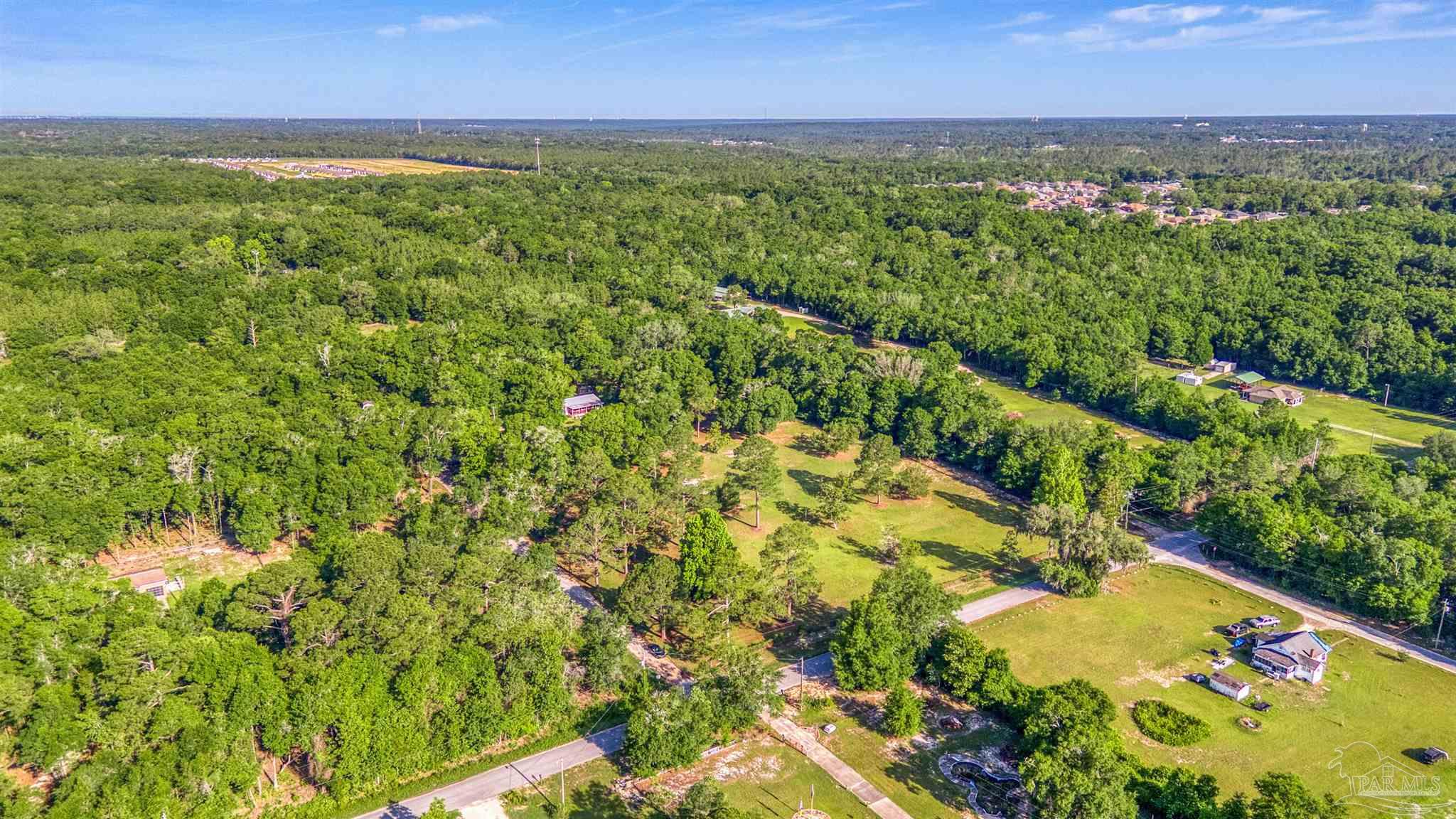 0 Morrison Road Milton, FL 32583 - Photo 18 of 21 an aerial view of residential houses with outdoor space and trees all around
