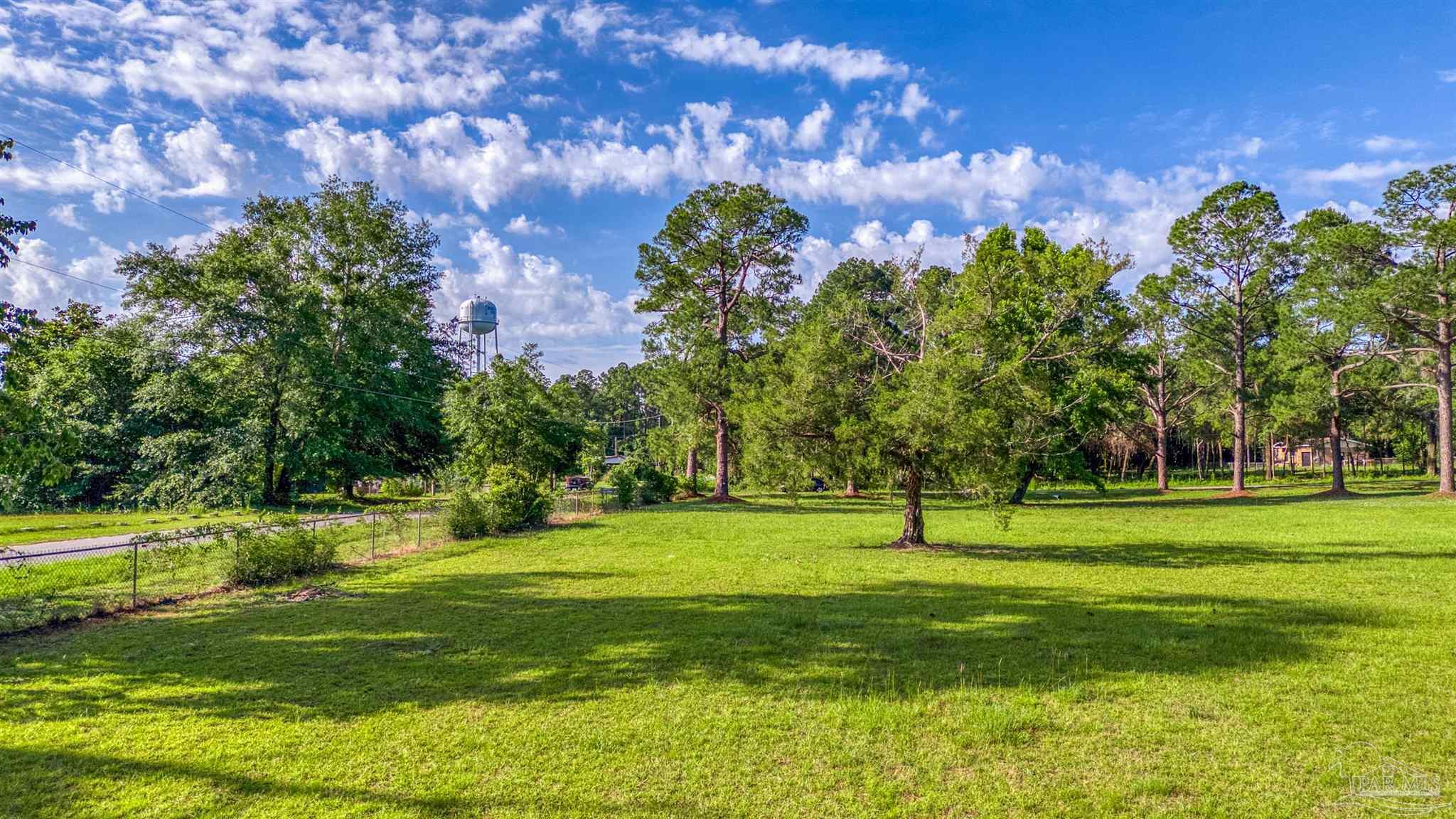 0 Morrison Road Milton, FL 32583 - Photo 5 of 21 a view of a golf course with a house