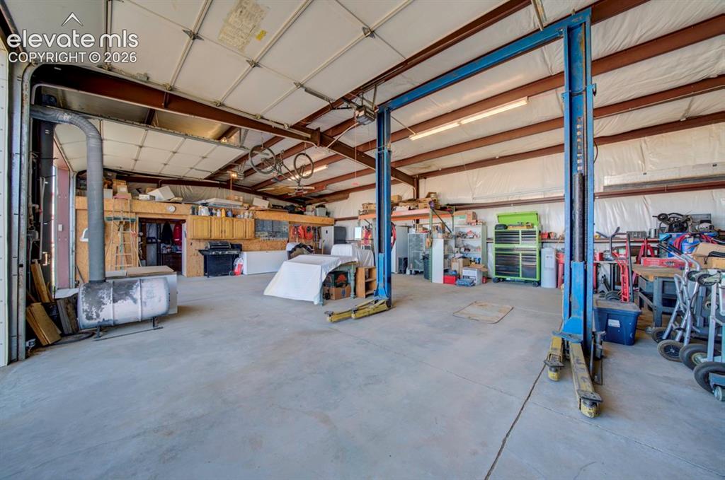 755 High Prairie Point Calhan, CO 80808 - Photo 41 of 50 With car lift