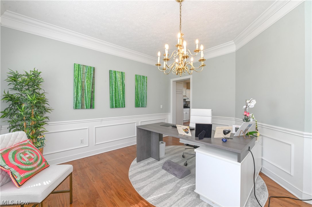 1688 Sheridan Road South Euclid, OH 44121 - Photo 14 of 48 Home office with hardwood / wood-style floors, a notable chandelier, ornamental molding, and a textured ceiling