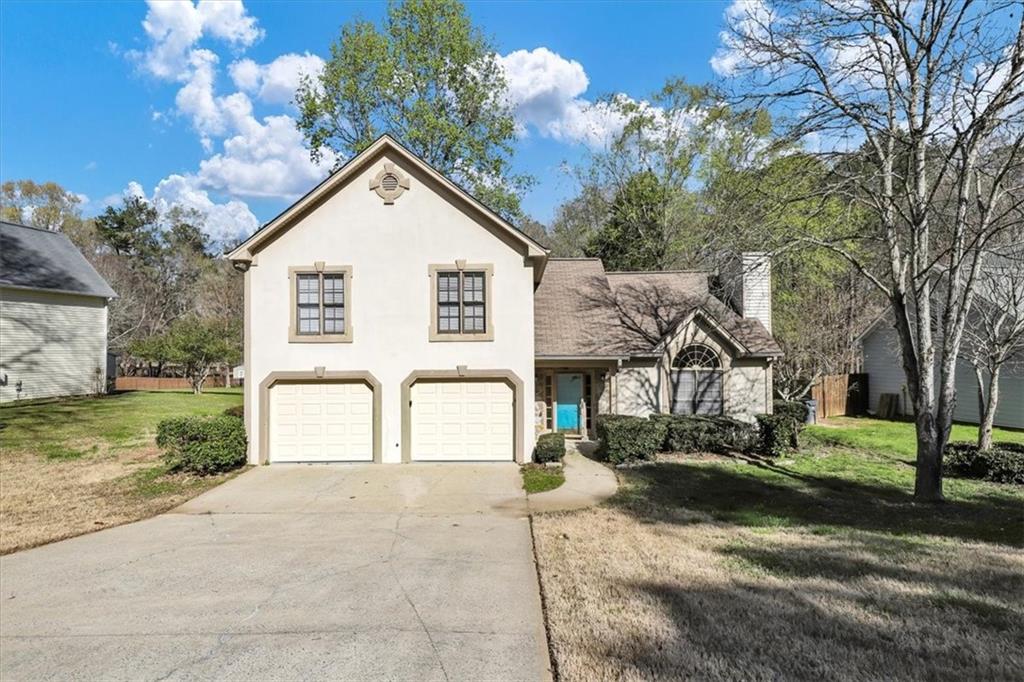 3403 Conley Downs Drive Powder Springs, GA 30127 - Photo 1 of 1 a view of a house with a yard and street view